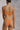 Person in an orange bikini standing with their back facing the camera.