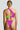 Woman wearing a colorful two-piece bikini with a one-shoulder design, viewed from the back.