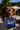 Woman holding a beach bag at a tropical resort