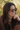 Woman with sunglasses smiling outdoors