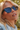 Person wearing blue-tinted sunglasses outdoors