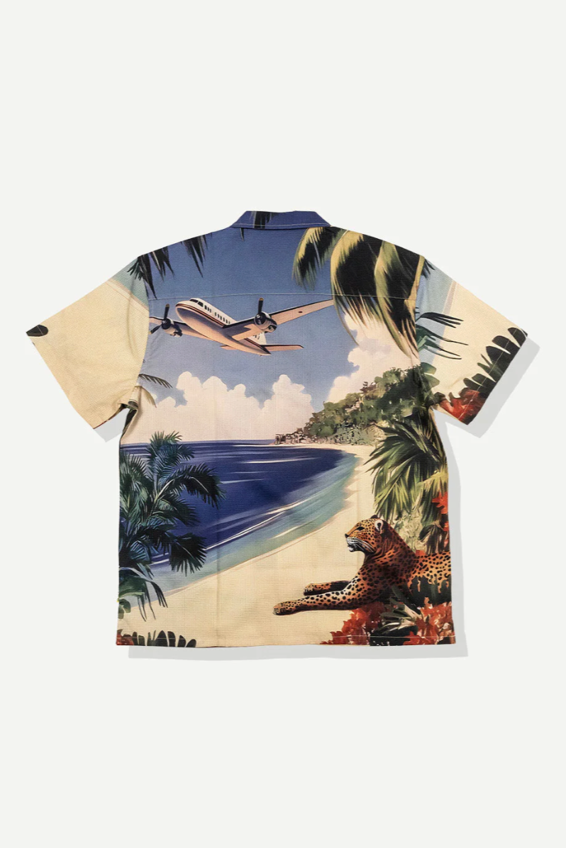 Hawaiian shirt with a tropical design featuring a leopard, airplane, and palm trees.