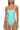 Woman wearing a light blue one-piece swimsuit with lace-up sides on a white background
